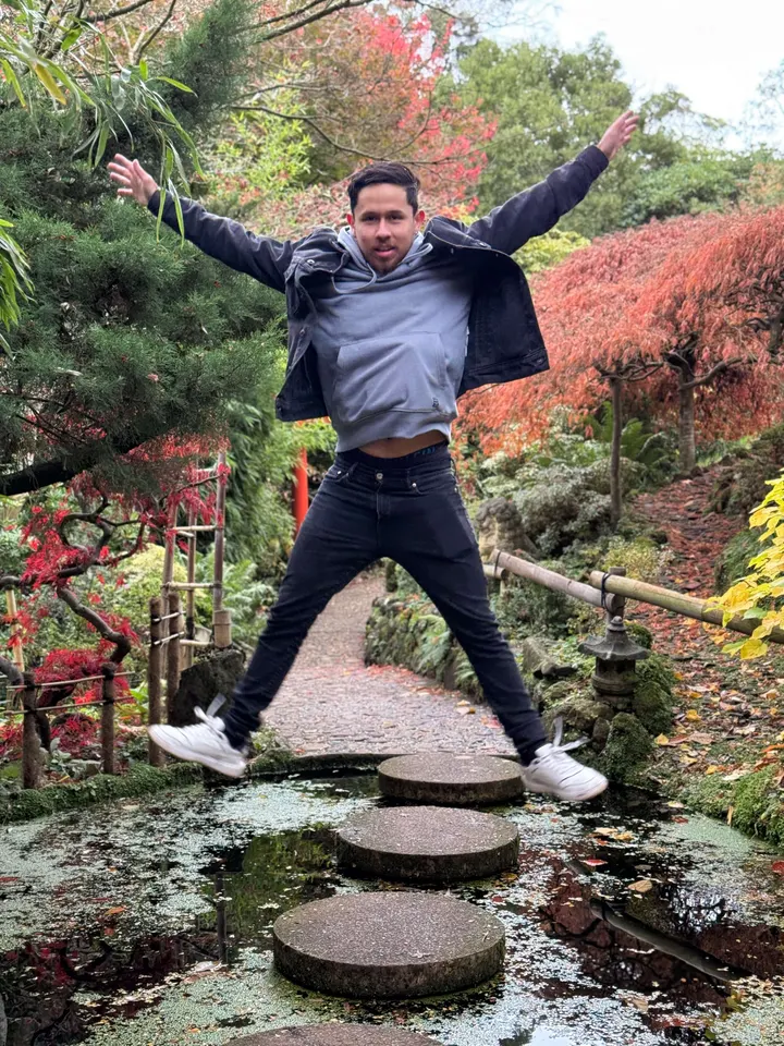 Andres jumping in a garden