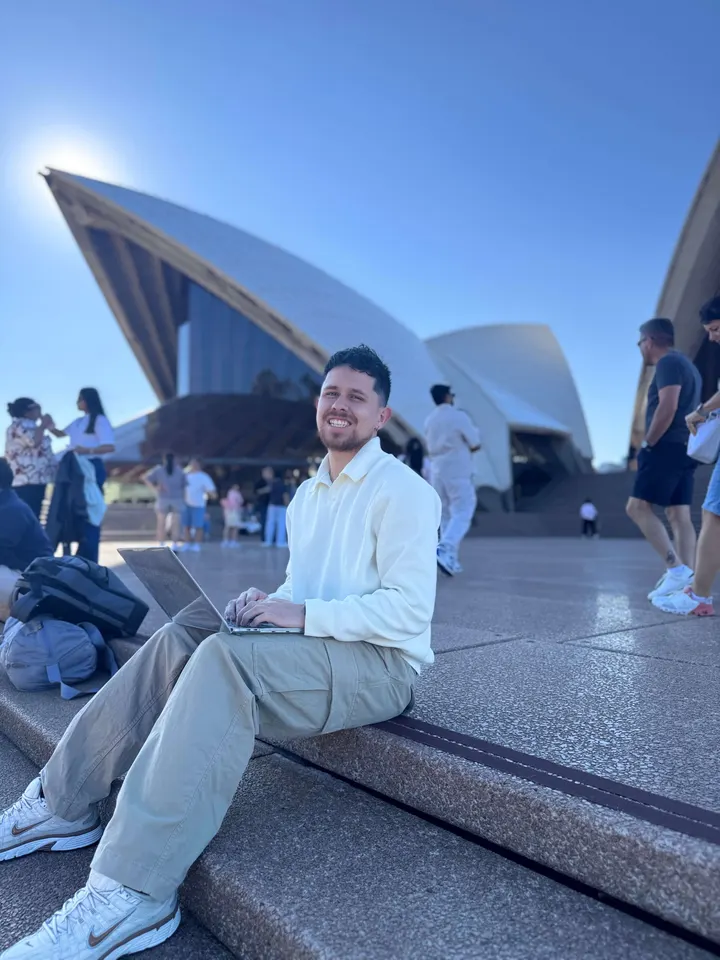 Andres sitting at the Sydney Opera House