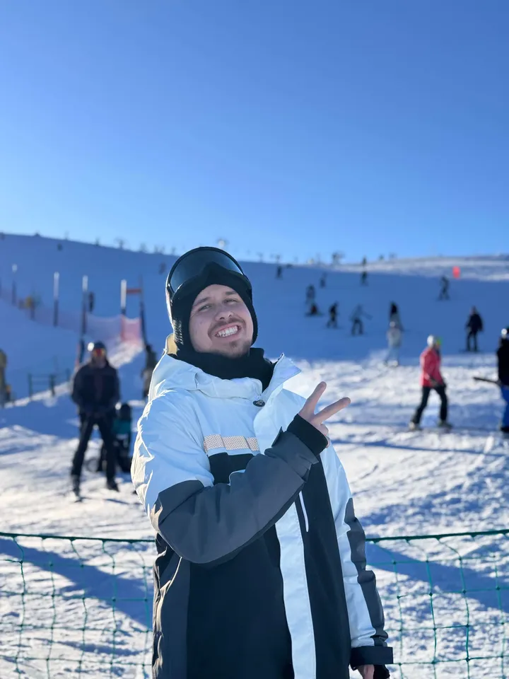 Andres on a ski slope on a sunny day
